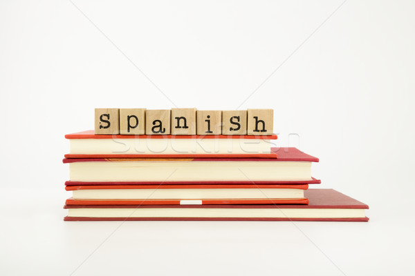 spanish language word on wood stamps and books Stock photo © vinnstock