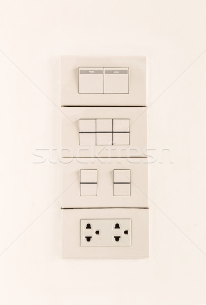 Electric light switches in of position and sockets Stock photo © vinnstock