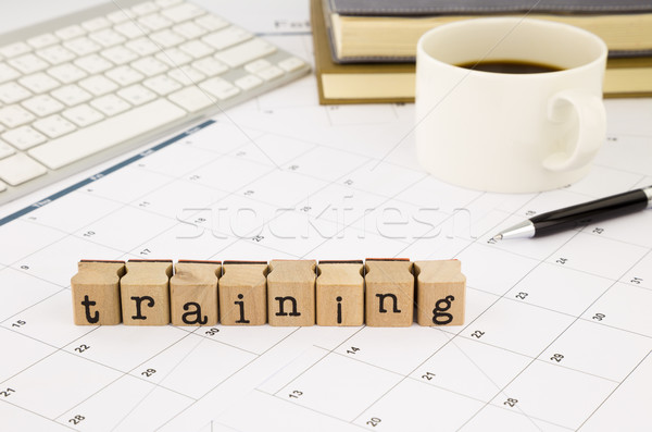 Stock photo: training wording and timetable on office table