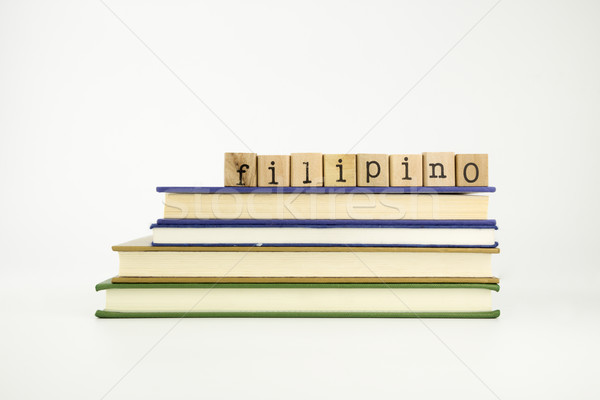 filipino language word on wood stamps and books Stock photo © vinnstock