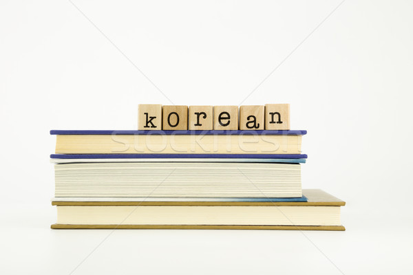 Stock photo: korean language word on wood stamps and books