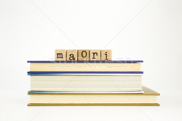 maori language word on wood stamps and books Stock photo © vinnstock