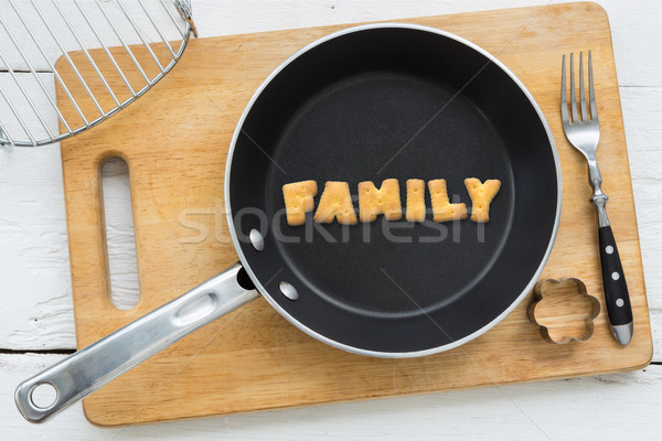 Letter biscuits word FAMILY and cooking equipments. Stock photo © vinnstock