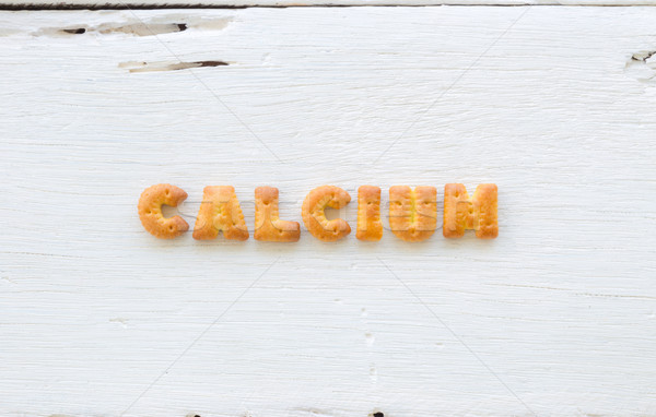 Kelime kalsiyum alfabe ahşap harfler kurabiye Stok fotoğraf © vinnstock