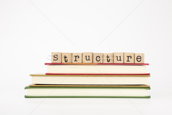 structure word on wood stamps and books Stock photo © vinnstock