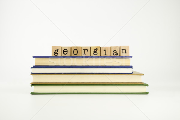 georgian language word on wood stamps and books Stock photo © vinnstock