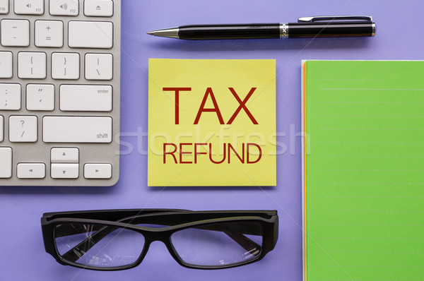 Notepad with words ' TAX REFUND '  Stock photo © vinnstock