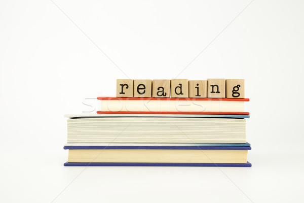 reading word on wood stamps and books Stock photo © vinnstock