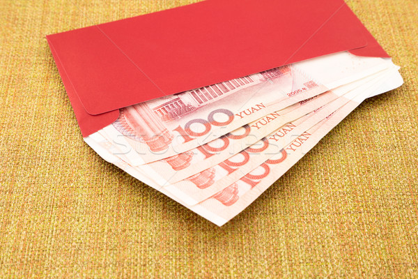 Stock photo: yuan banknote and red envelope