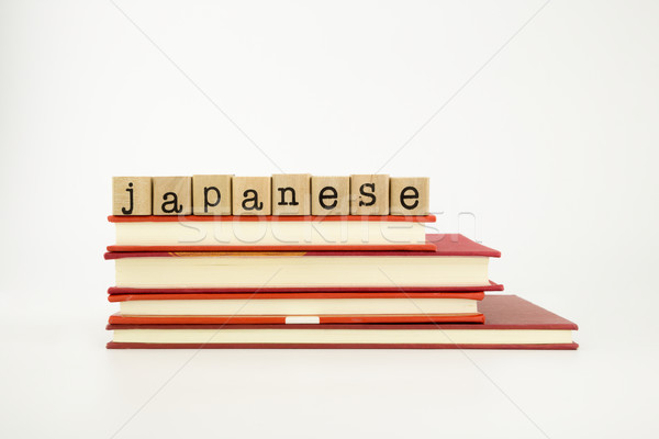 japanese language word on wood stamps and books Stock photo © vinnstock