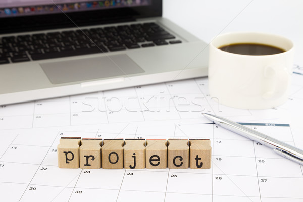 project wording, calendar and laptop on office table Stock photo © vinnstock