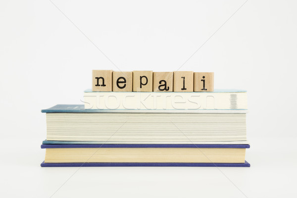 nepali language word on wood stamps and books Stock photo © vinnstock