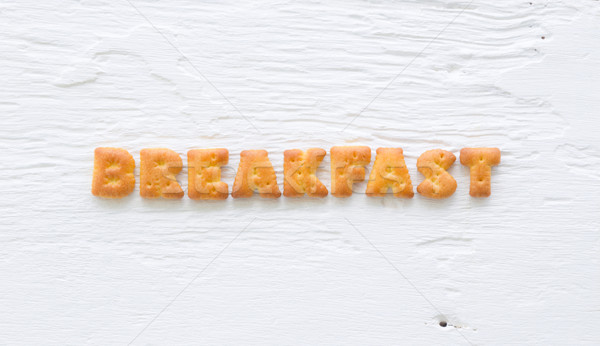 Word BREAKFAST Alphabet crackers on wood background Stock photo © vinnstock