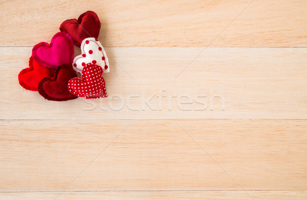 Red valentine hearts symbol on wood background Stock photo © vinnstock