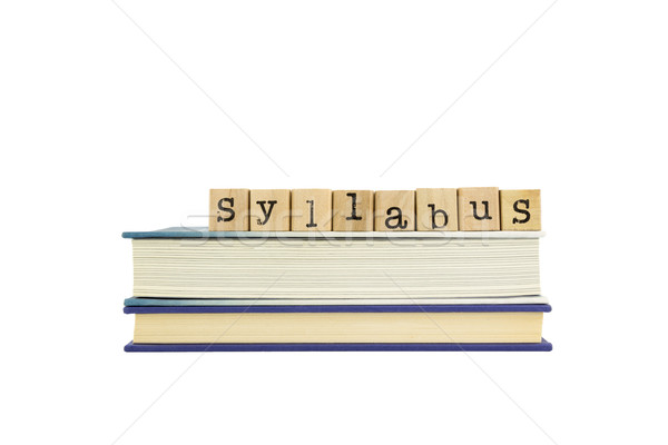 Stock photo: syllabus word on wood stamps and books