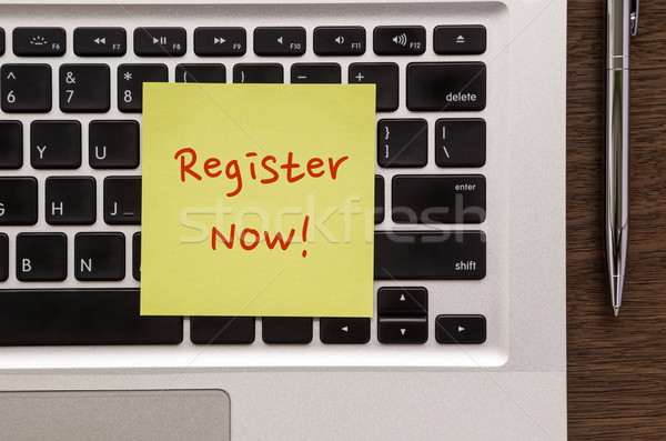 Notepad with words ' Register Now ' putting on laptop  Stock photo © vinnstock