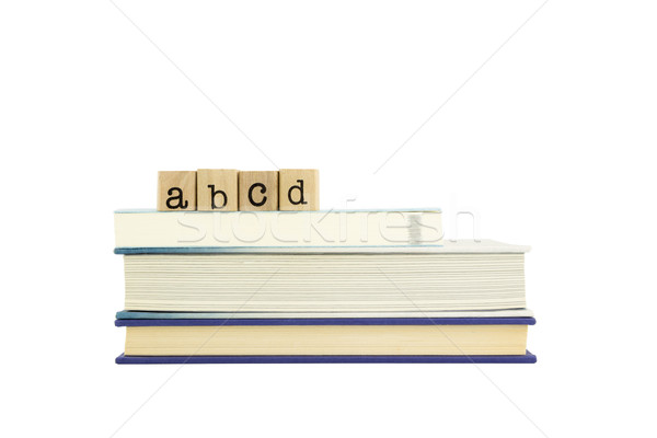 abcd word on wood stamps and books Stock photo © vinnstock
