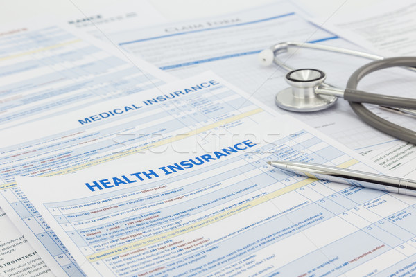 Medical insurance application and legal contract Stock photo © vinnstock