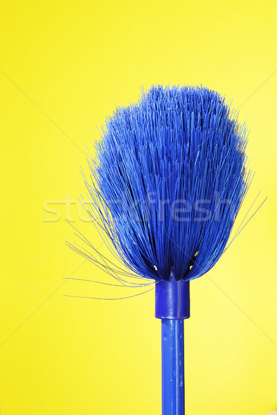 Blue Broom on yellow Stock photo © vinodpillai