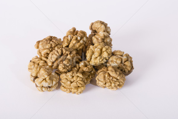 Shelled whole walnuts on white Stock photo © vinodpillai
