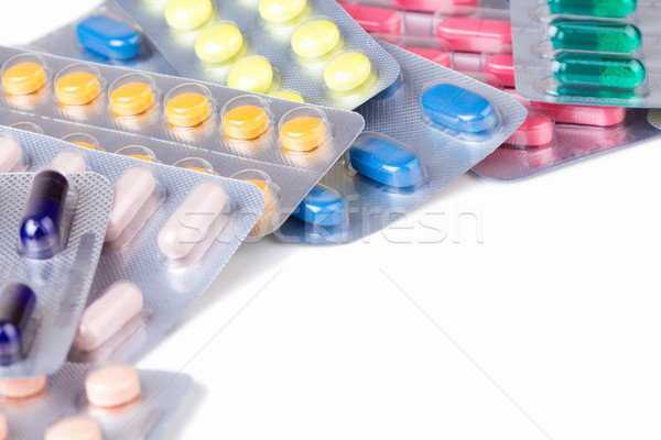 Bunch of pills and capsules in aluminum container Stock photo © viperfzk