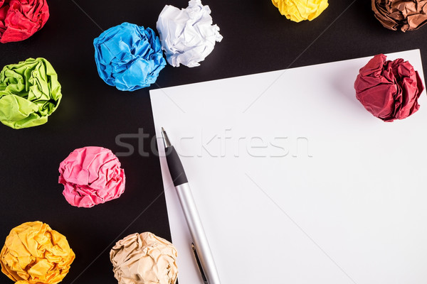 Creased color papers with white paper and ballpen Stock photo © viperfzk