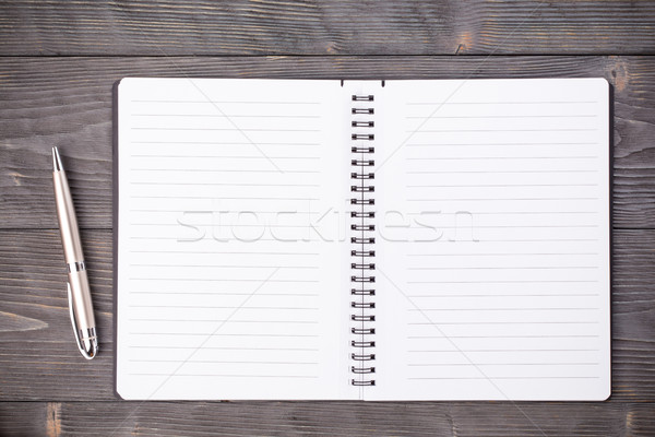 Office supply ballpen with notepad on wooden table  Stock photo © viperfzk