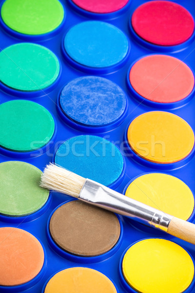 Light paintbrush and unused water paint Stock photo © viperfzk