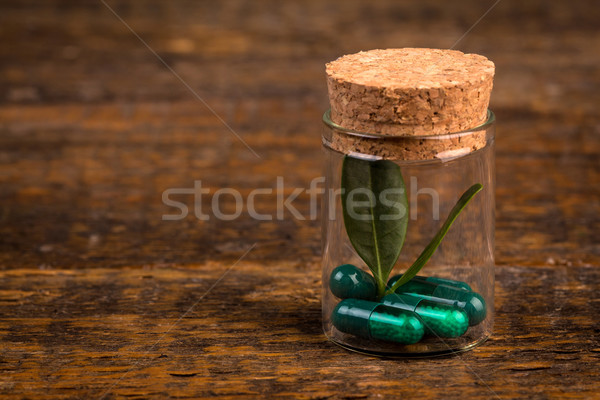 Alternative homeopathic medicine in glass container Stock photo © viperfzk