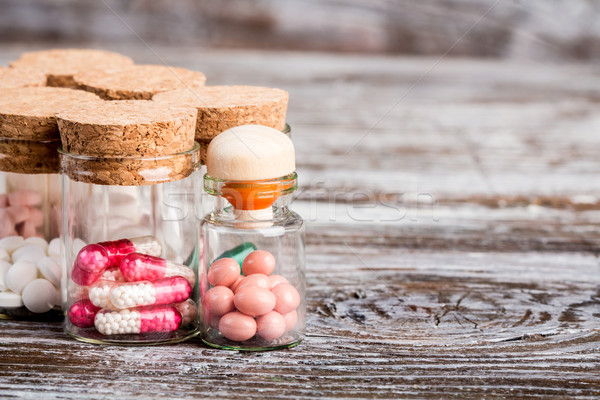 Various medicine in glass containers with cork caps Stock photo © viperfzk