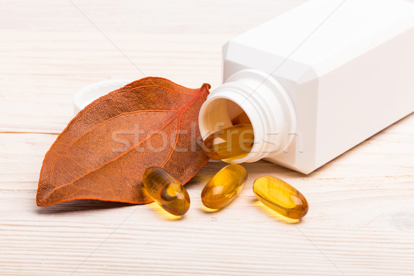 Gel medicina laranja folha branco recipiente Foto stock © viperfzk