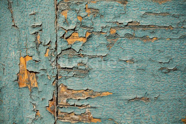 Vintage wood wallpaper with peeling turquoise paint Stock photo © viperfzk