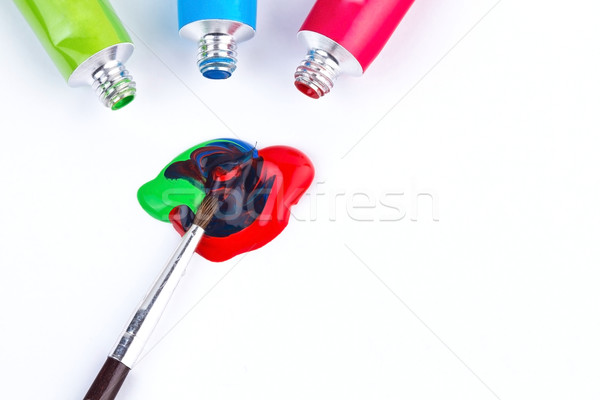 Water based paints with paintbrush mixing colors Stock photo © viperfzk
