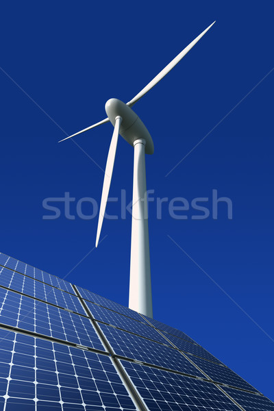 Solar panels and wind turbine against a blue background Stock photo © visdia