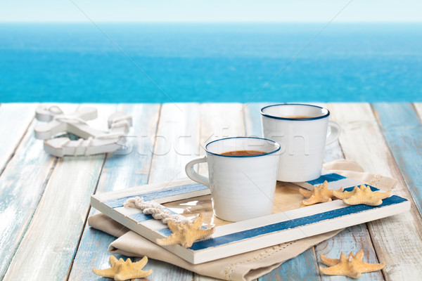 Tasse Kaffeetasse Kaffee Holztisch blau Meer Stock foto © Vitalina_Rybakova