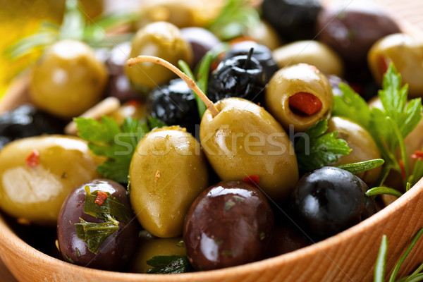 Marinated olives with herbs.  Stock photo © Vitalina_Rybakova