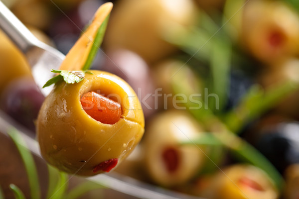 Marinated olives with herbs.  Stock photo © Vitalina_Rybakova