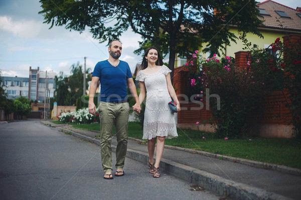 Young attractive couple: pregnant mother and happy father Stock photo © vizarch