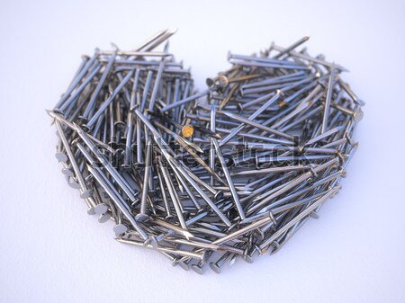 Heart Made from Metal Nails on a White Background Stock photo © vizarch