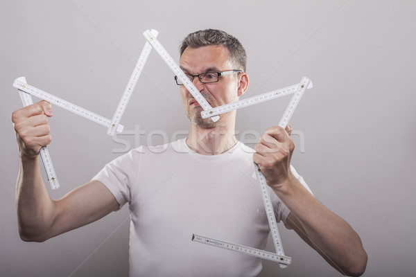 Man inable to fold ruler Stock photo © vizualni