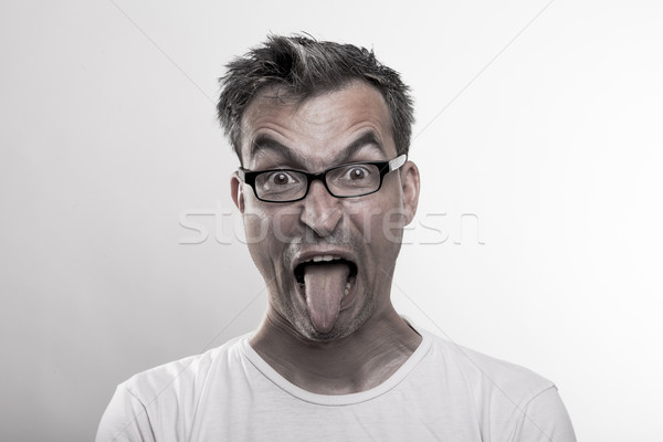 Portré férfi undor ki nyelv középső Stock fotó © vizualni