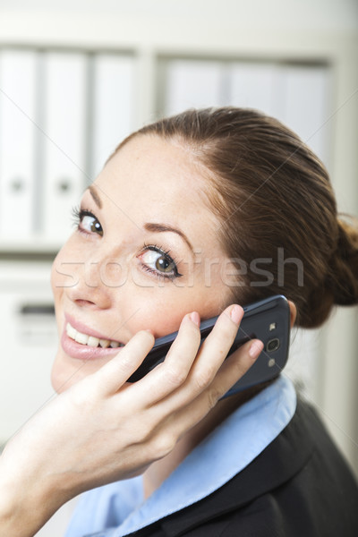 Businesswoman has a call Stock photo © vizualni