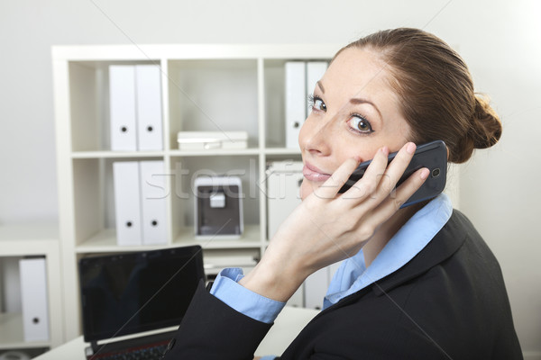 Businesswoman has a call Stock photo © vizualni