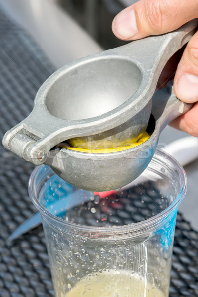 manual metal juicer lemon in a plastic Cup Stock photo © vlaru