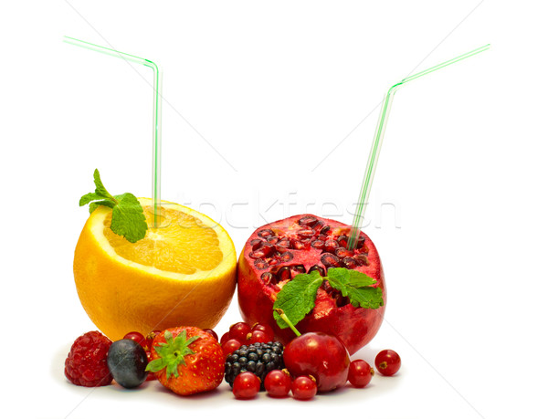 Stock photo: orange and pomegranate with a straw and berries on a white background