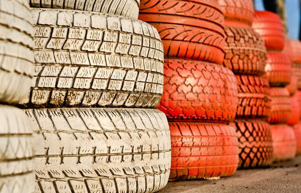close up of racetrack fence of white and red of old tires Stock photo © vlaru