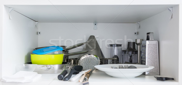 Various tableware on shelf in the kitchen Stock photo © vlaru