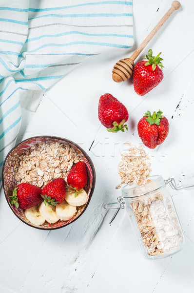 Healthy breakfast with cereals, banana and strawberry Stock photo © voloshin311