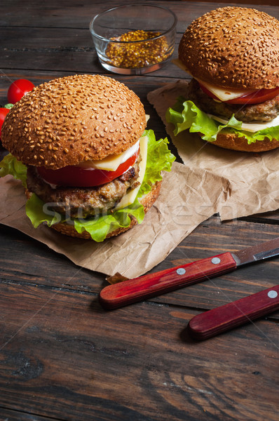 Fresh burger closeup on rustic wooden table Stock photo © voloshin311