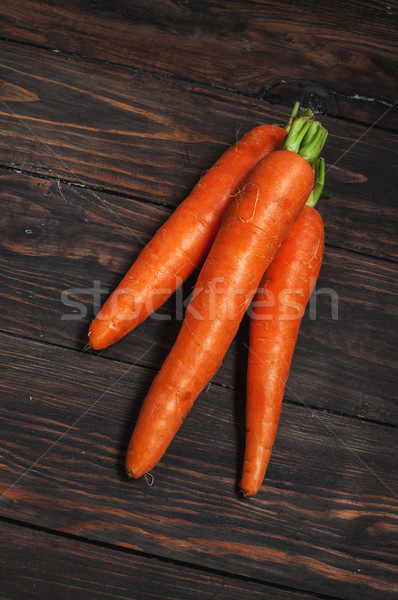 Fresh carrots bunch on rustic wooden background Stock photo © voloshin311